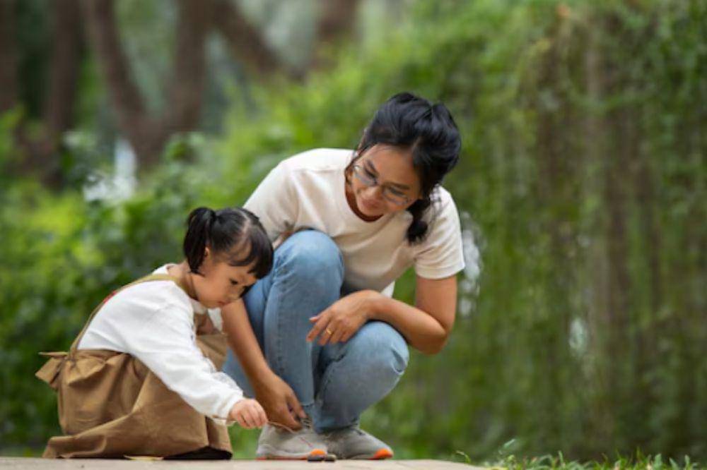 mom playing with her kid 