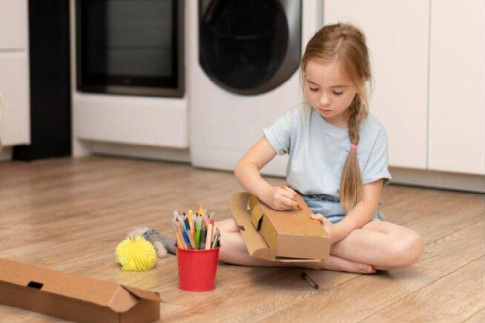 kid tidy up her toys