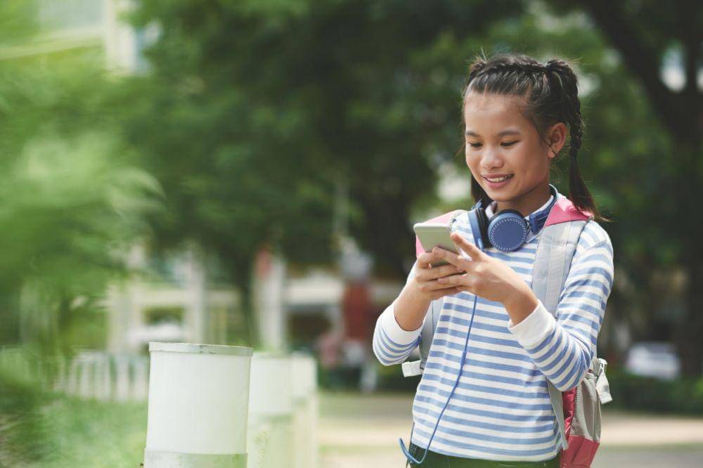 asian girl texting message