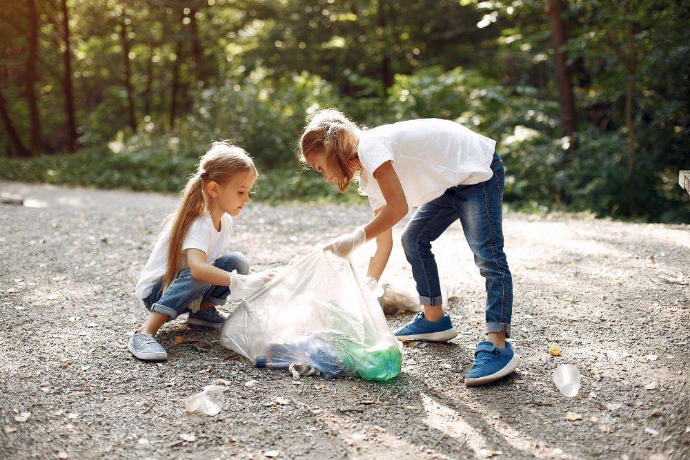 Children collects garbage in garbage bags