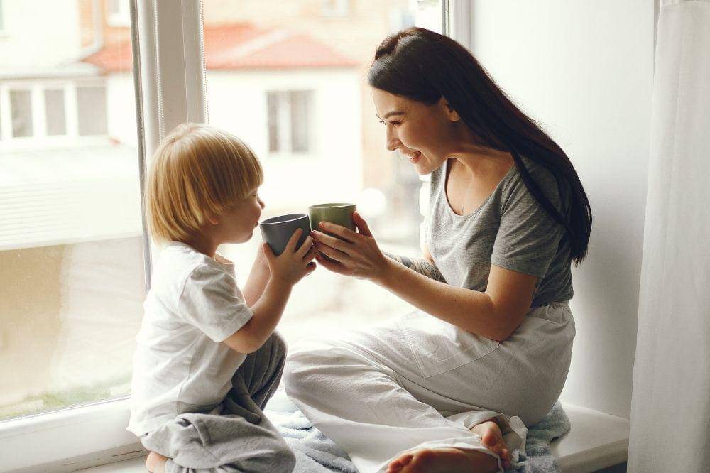 Mother and little son sitting