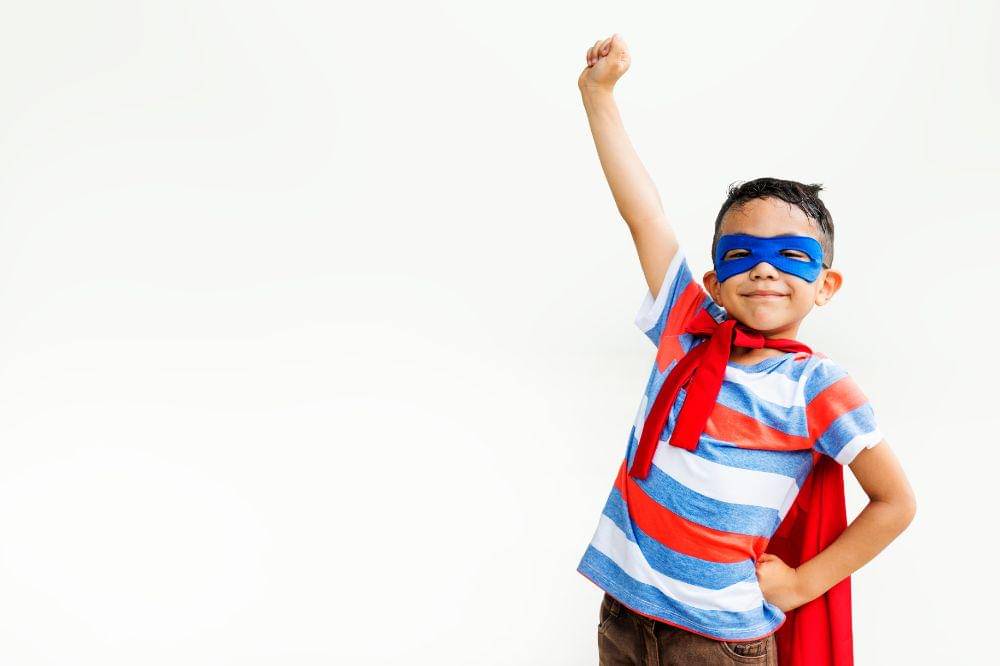 Little boy playing superhero
