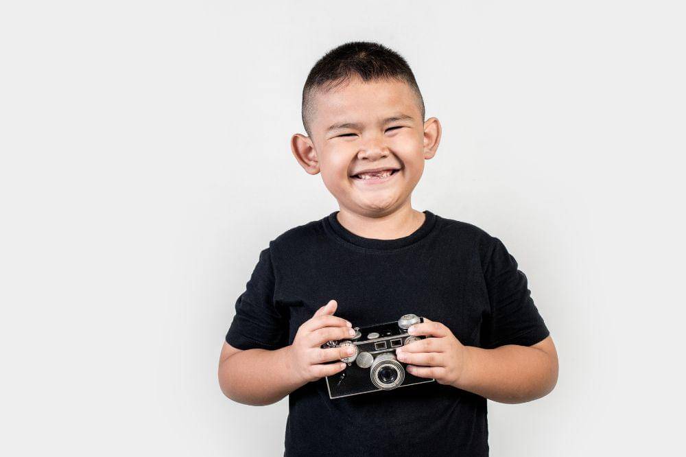 Kid photographer take a photo