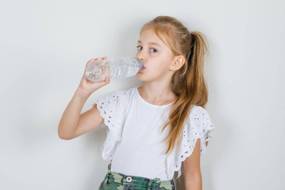 Little girl drinking water