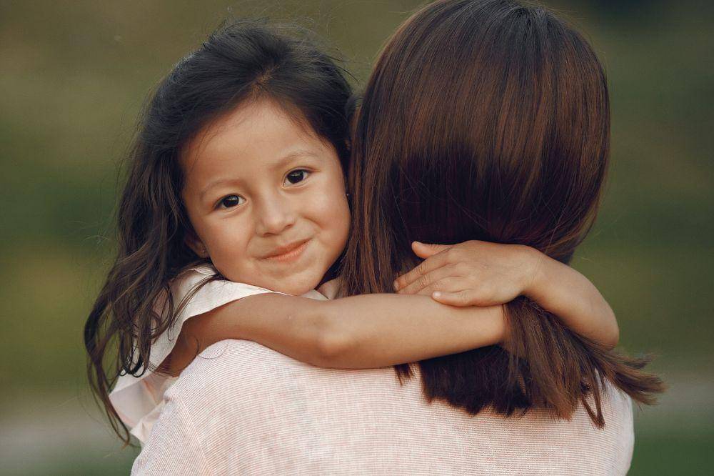 mother with daughter in a summer park