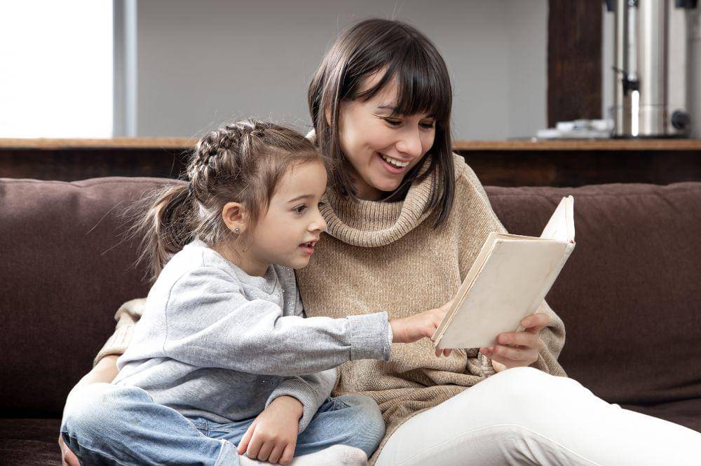 Mom and daughter reading a book