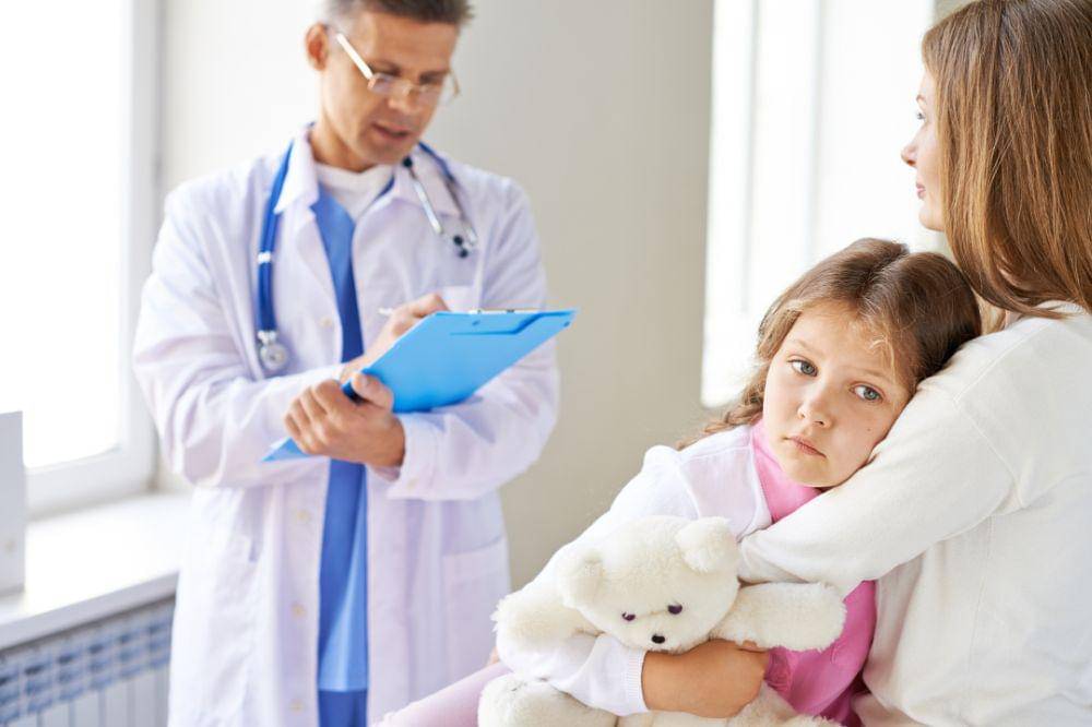 Sad little girl in the medical office