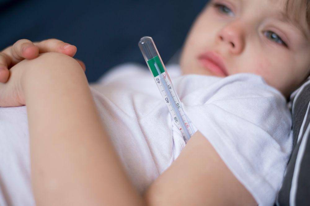 Close-up child and thermometer