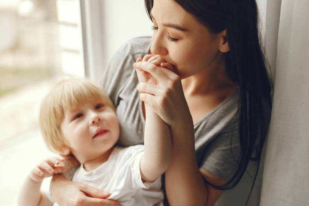 Mother and little son sitting