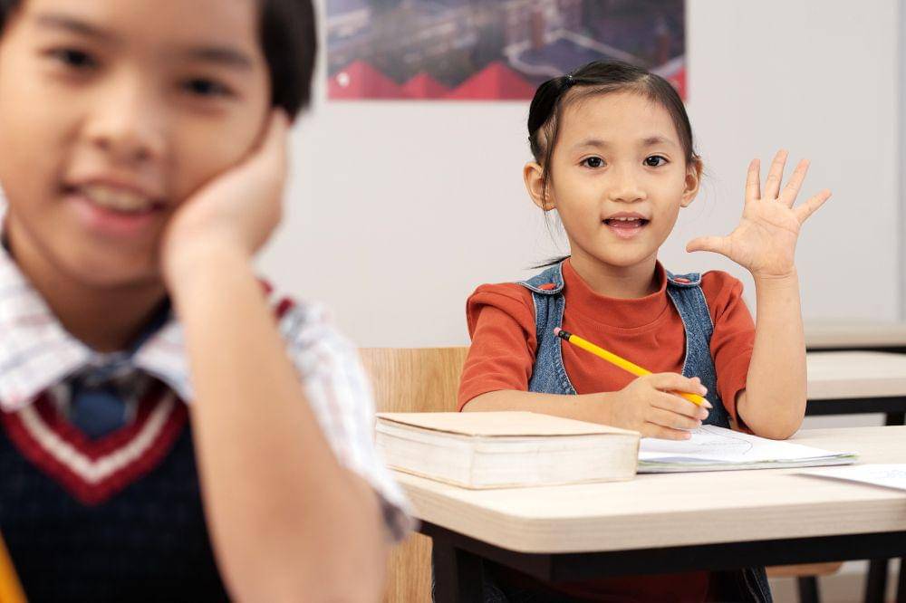 girl putting up hand