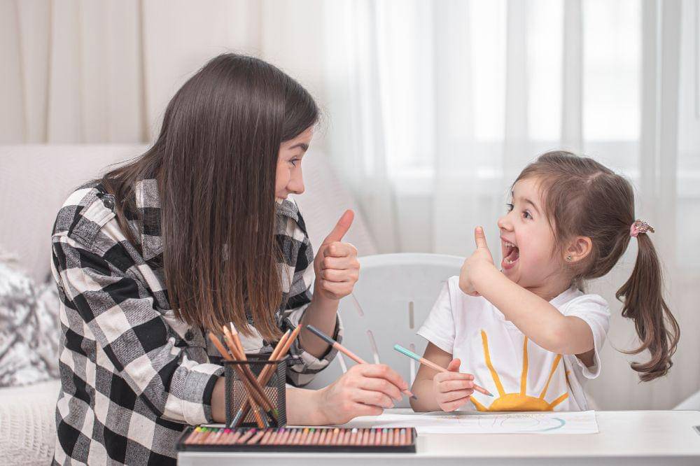 A mother with a child sits