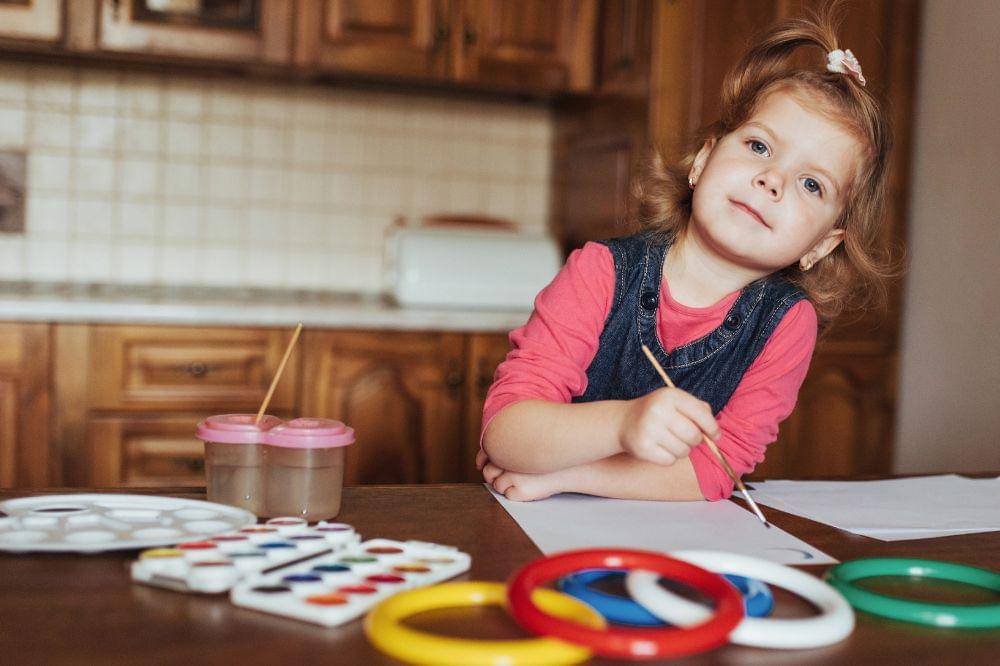Adorable preschooler painting