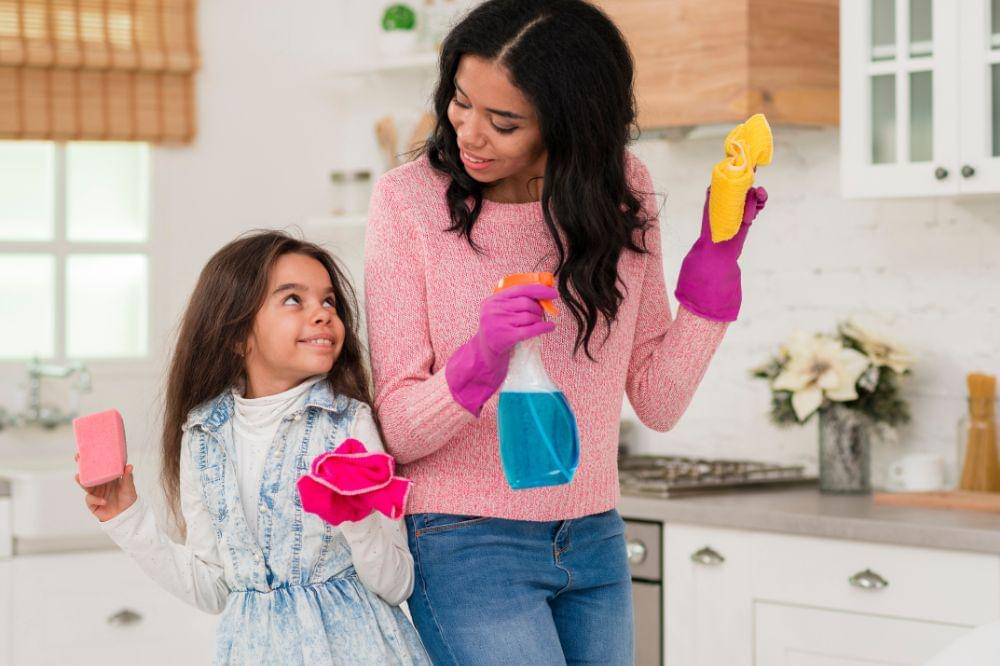 Mom and daughter cleaning the house