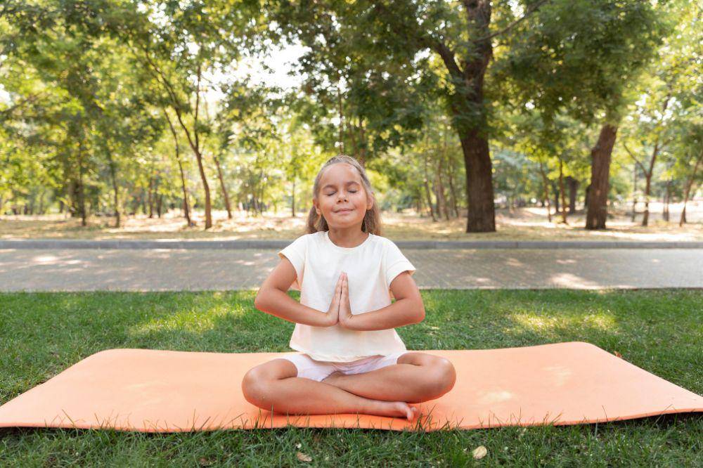 girl meditating on yoga mat