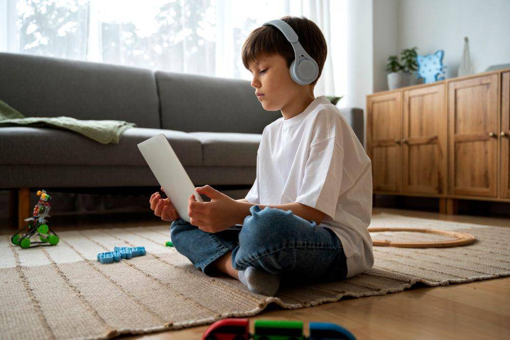 boy watching film on laptop
