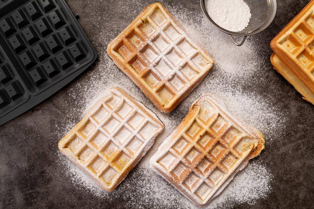 Waffles covered in powdered sugar