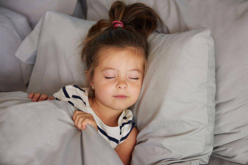 Sleeping girl in the bed