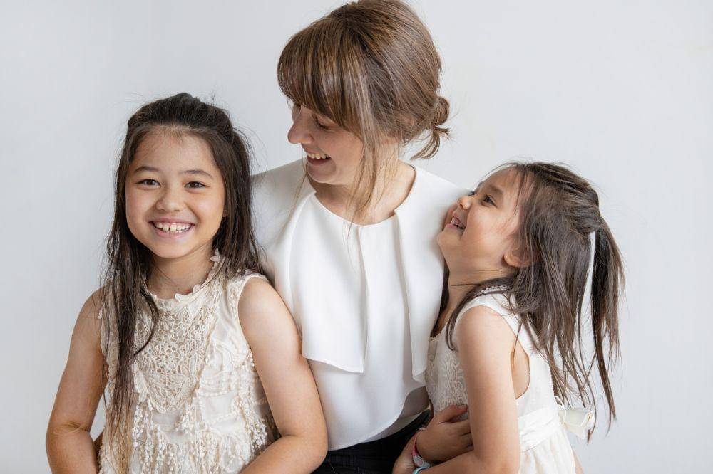 Happy mom with her daughters