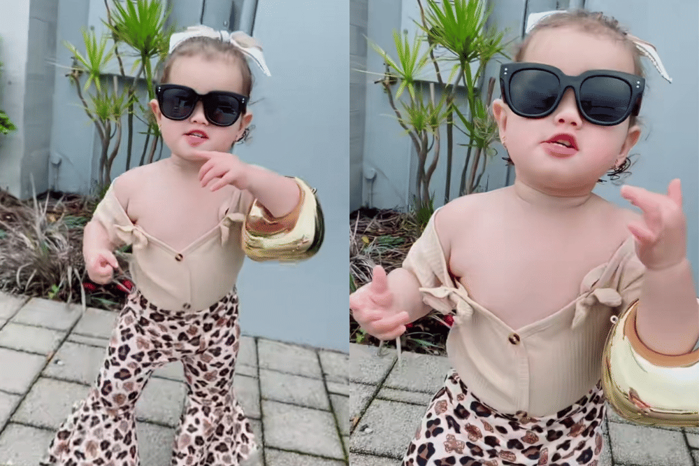 Briella memakai atasan coklat dan celana cutbray bermotif leopard