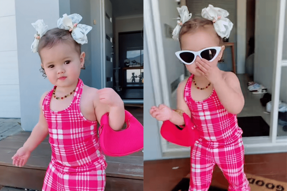 Briella memakai set kotak-kotak putih dan hot pink dengan aksesori serasi