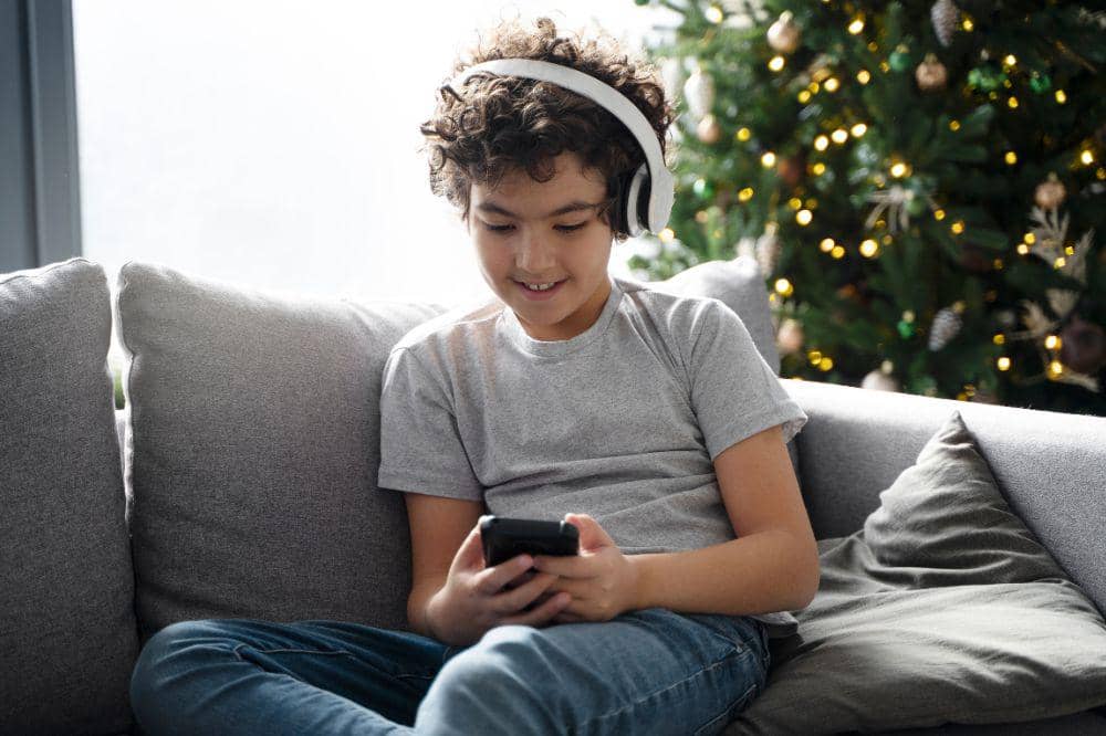 young kid playing phone