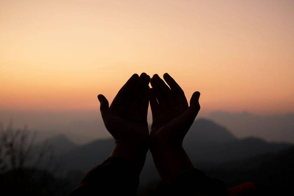 Teenage girl with praying. Peace, hope, dreams concept