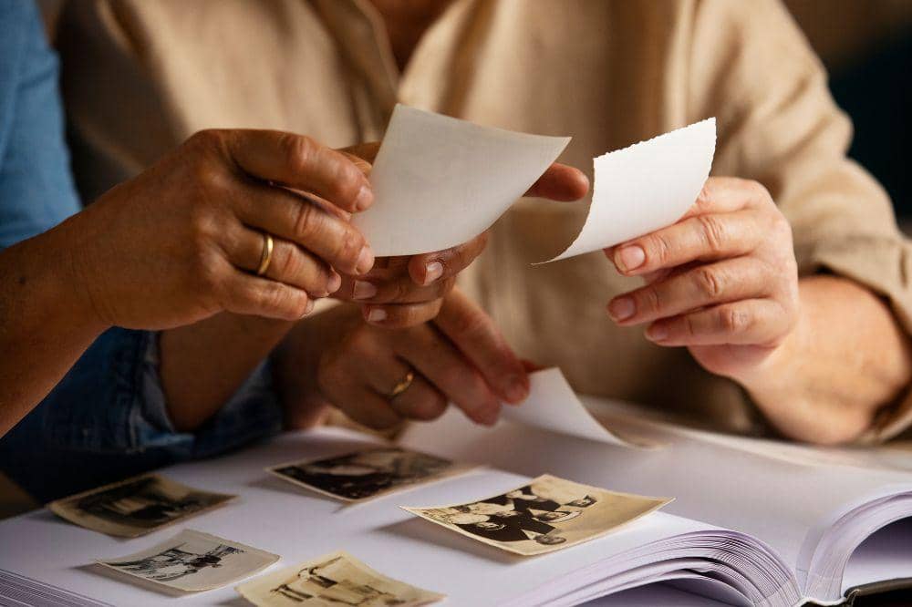 People looking over picture album