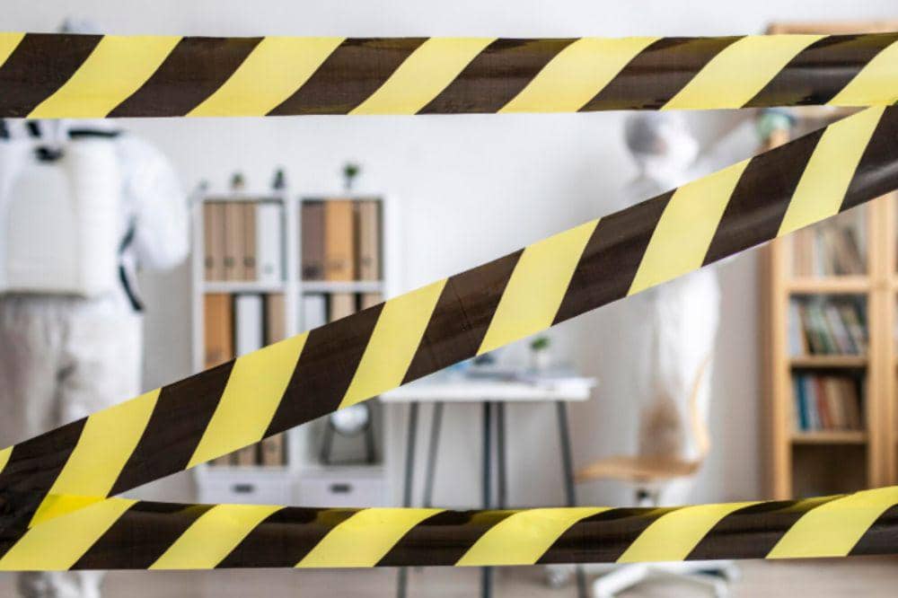 People in protective equipment disinfecting