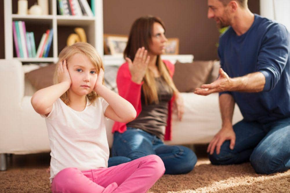 Little girl doesn't want to hear arguing of parents