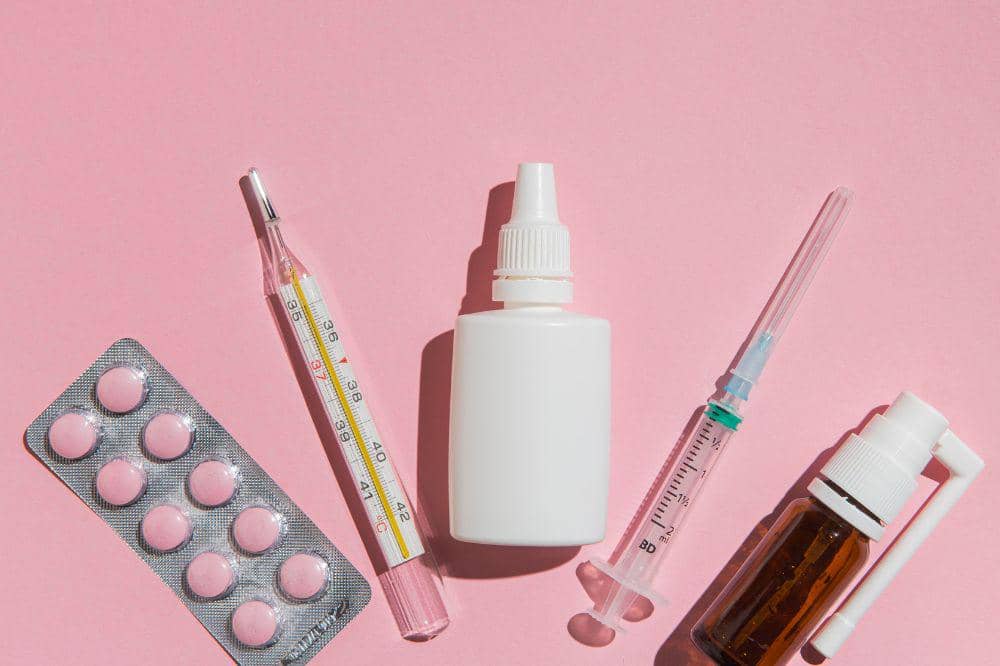 Top view tablets with thermometer on the table