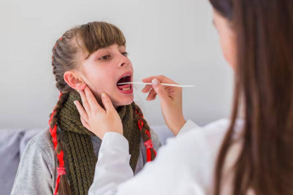 Ill girl being examined by the doctor