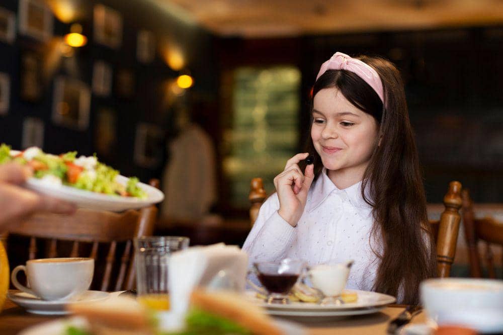 Close up smiley girl at table