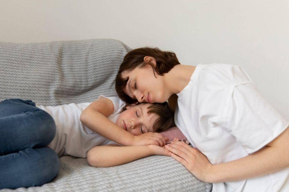 Medium shot mother sitting near girl