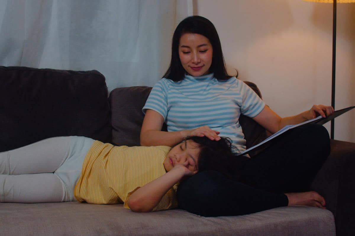 young asian family read fairy tale