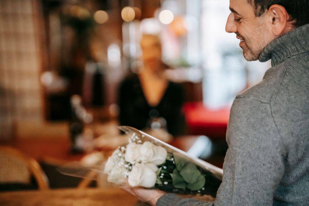 man giving flowers