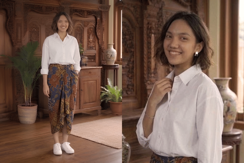 Kemeja oversized dengan batik lilit asimetris