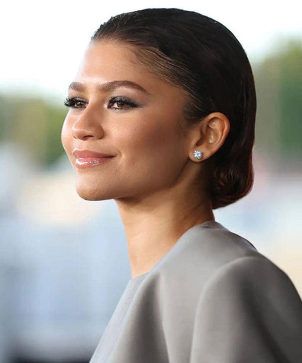 rambut zendaya slicked-back and tucked under