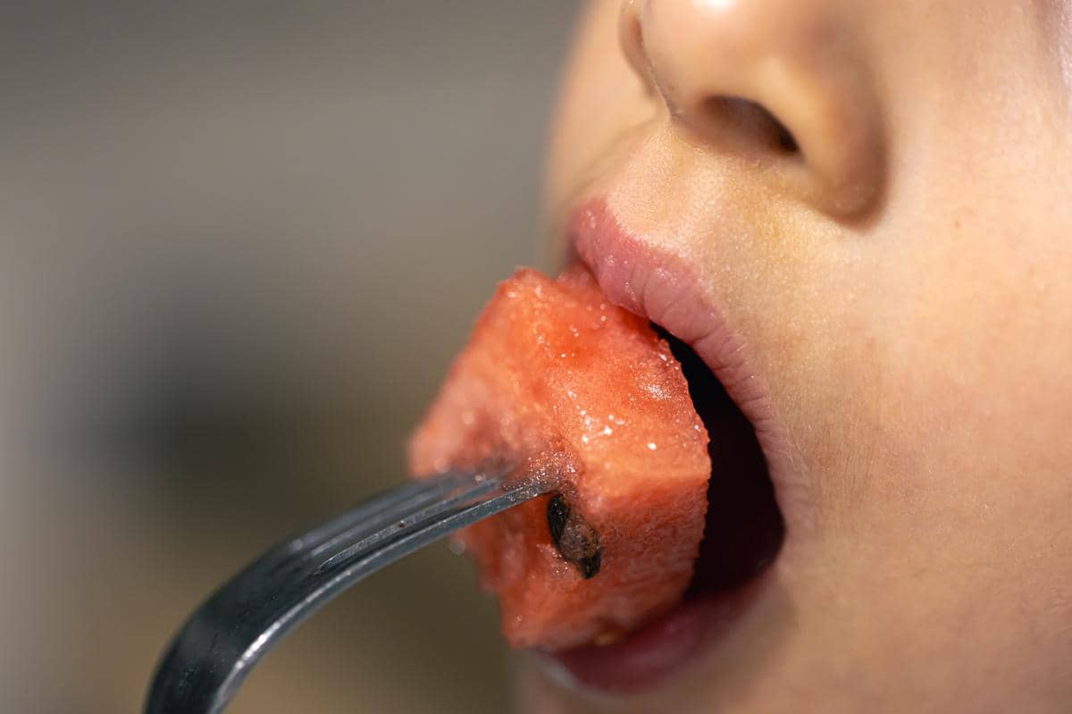 detailed-shot-girl-bites-watermelon.jpg