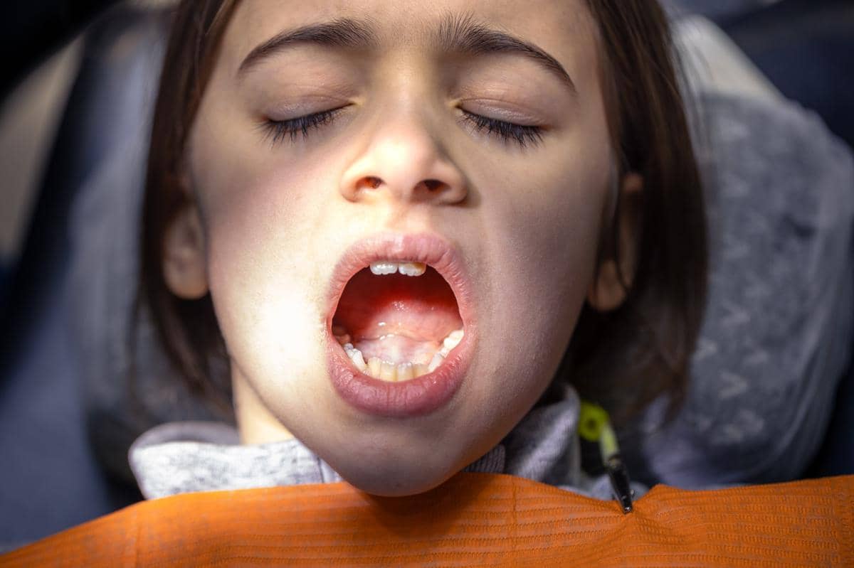girl-dentists-office-dentist-examining-child-patients-teeth-dentistry-concept.jpg