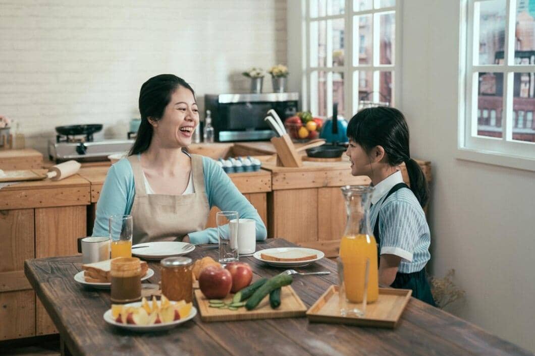 asian-chinese-young-mother-with-children-having-breakfast-kitchen-home-happy-parent-kid-relationship-family-laughing-woman-housewife-apron-with-daughter-wear-uniform-talking-morning_678158-1314.jpeg