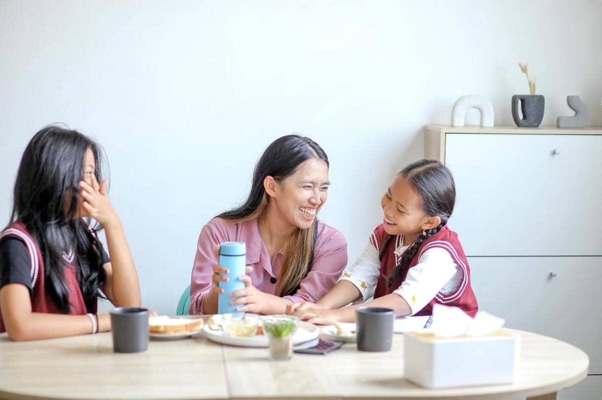 cheerful-asian-family-having-fun-together-while-eating-breakfast_603656-11149.jpeg